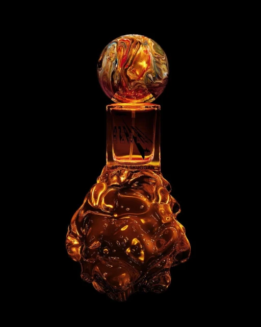 Abstract view of a perfume bottle with a clear glass body and decorative orb cap, set against a dark background.