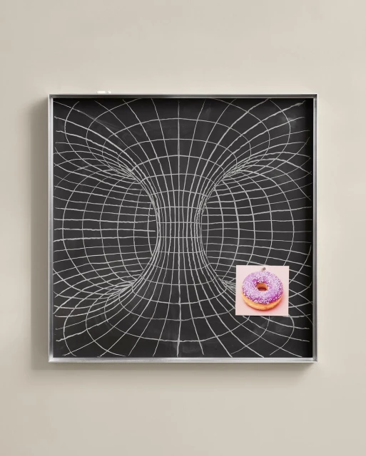 Abstract illustration of a black chalkboard with a wormhole graphic and a donut on pink paper attached, conveying a mix of science and snack.