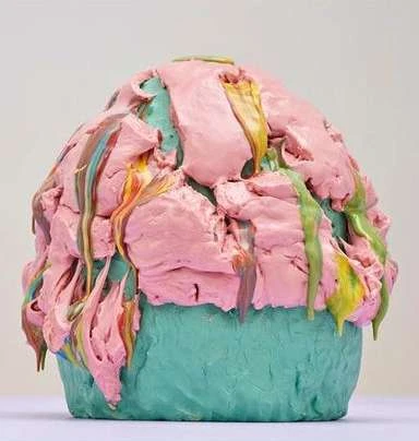Close-up of an artful, abstract confection or cake-like structure. Heavy impasto-style textures define this colorful dessert representation.