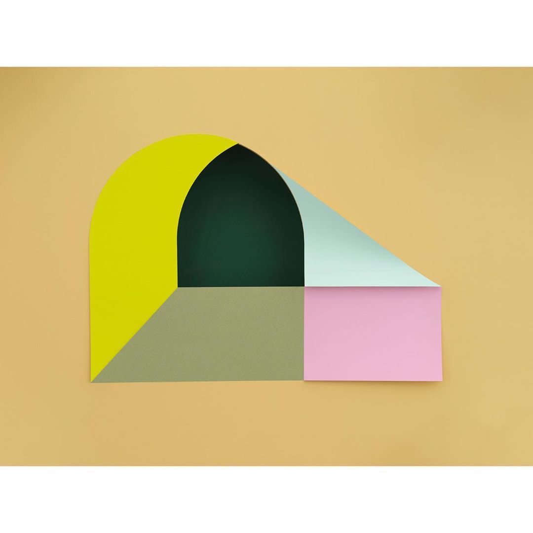 Abstract paper art featuring geometric shapes in yellow, green, pink, and teal on a tan background, creating a contemporary aesthetic.