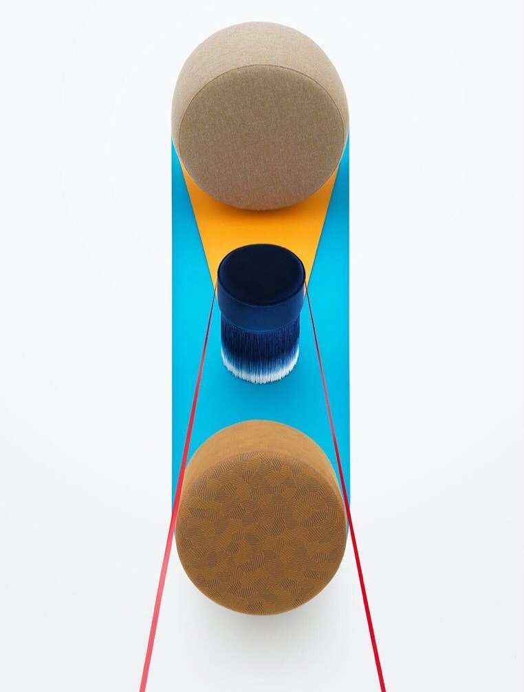 Abstract art featuring geometric shapes, cylinders, spheres, and red string, set against a white background, rendered with studio lighting.