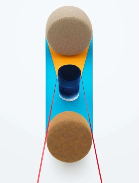 Abstract art featuring geometric shapes, cylinders, spheres, and red string, set against a white background, rendered with studio lighting.