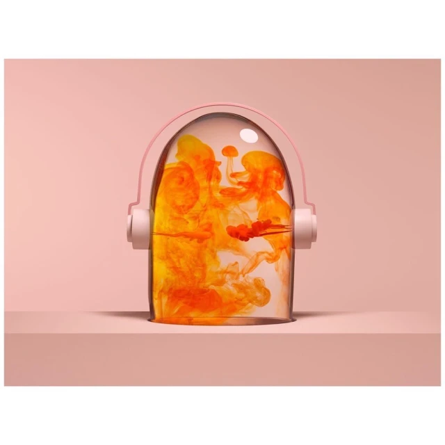 Abstract still life featuring orange liquid swirls in a clear, rounded container with pink handles, set against a soft pink background.