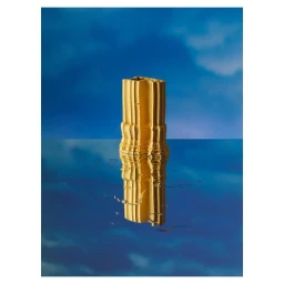 Gold architectural column sculpture reflected on a glossy blue surface against a textured blue sky background by Carl Kleiner.