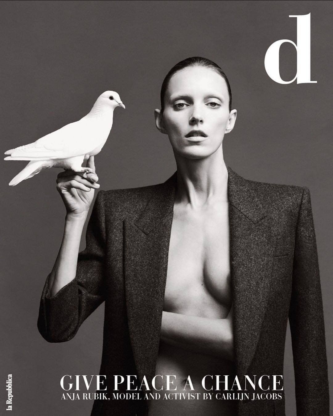 Magazine cover features a female model in a blazer holding a white dove against a grey backdrop with text 'Give Peace a Chance'.