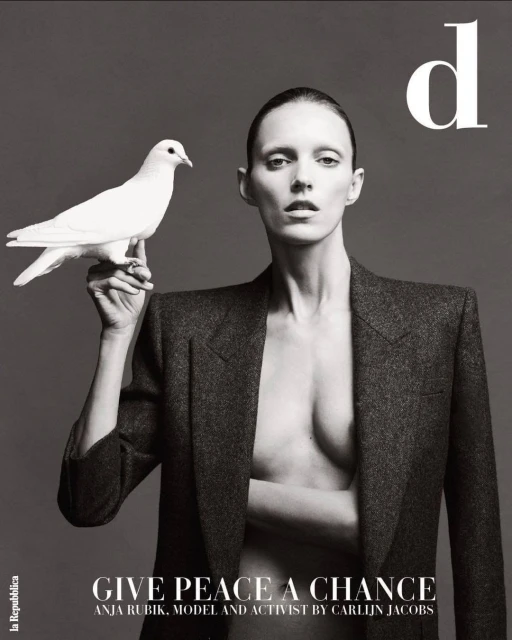Magazine cover features a female model in a blazer holding a white dove against a grey backdrop with text 'Give Peace a Chance'.
