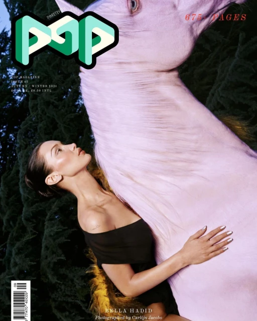 Magazine cover featuring Bella Hadid and a light purple horse, set against a dark green background, with 'POP' logo.