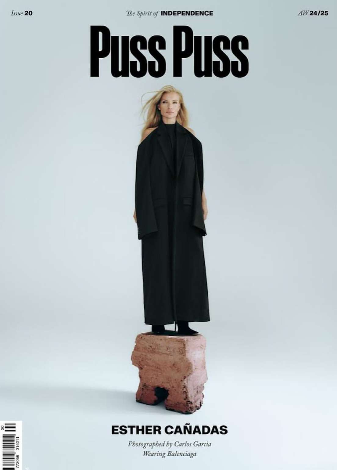 Magazine cover featuring Esther Cañadas in Balenciaga, standing on a stone pedestal, against a light background with Puss Puss branding.