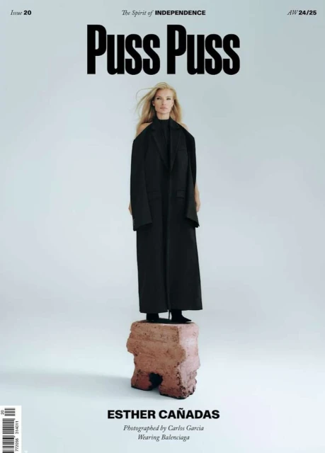 Magazine cover featuring Esther Cañadas in Balenciaga, standing on a stone pedestal, against a light background with Puss Puss branding.