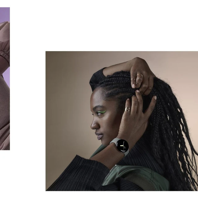 Woman with braided hair wearing a smartwatch in a studio setting, showcasing beauty and technology with a soft, diffused lighting.