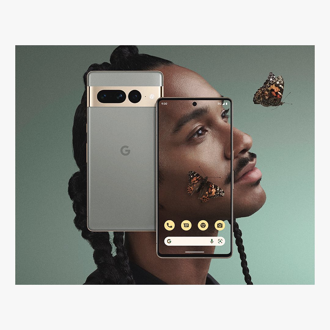 Close-up studio shot featuring a man's face displayed on a smartphone screen next to a Google Pixel phone, with butterflies.