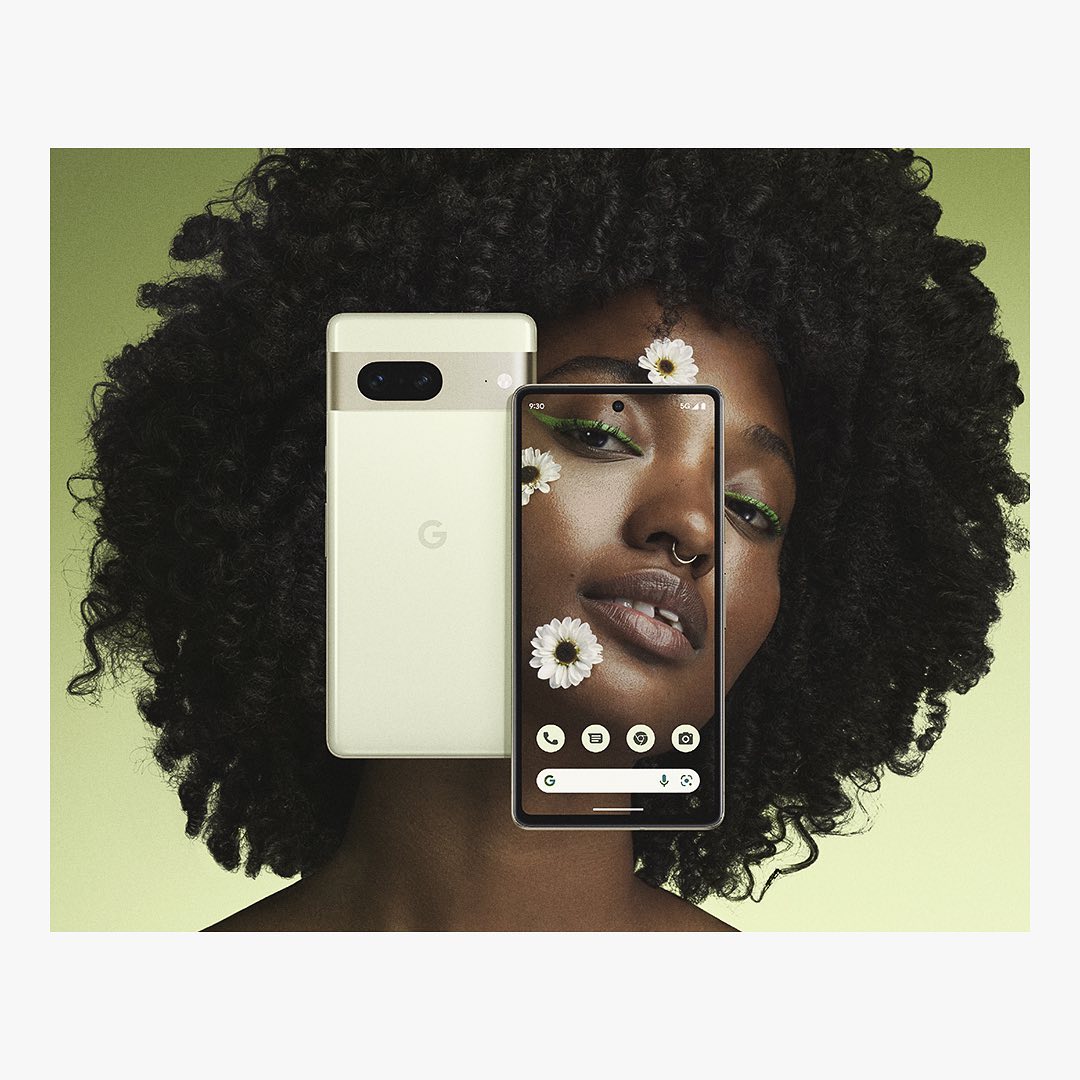 Striking studio shot of a Black female model showcasing two Google Pixel phones, adorned with floral accents against a soft green backdrop.