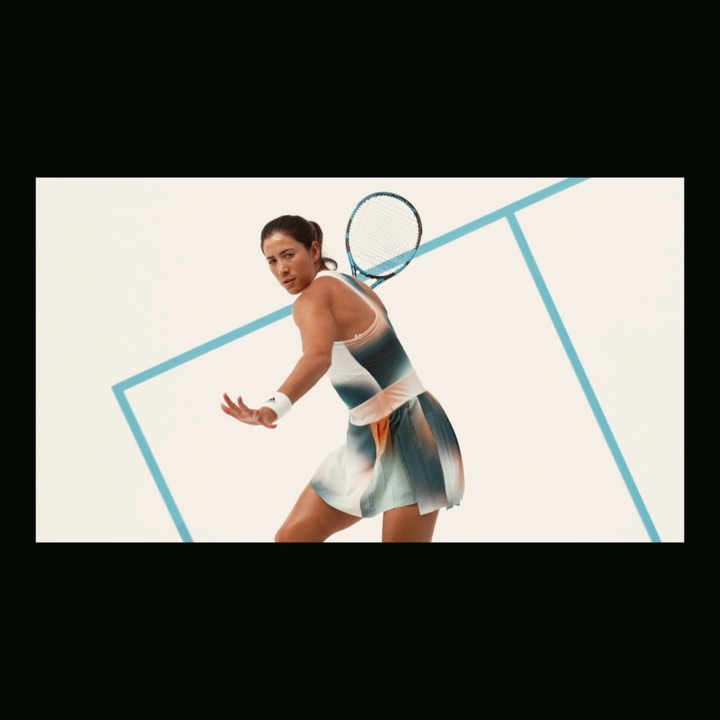 Female tennis player in motion, swinging racket on light background with blue geometric lines. Action shot, sport and athletic theme.