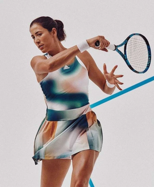 Female tennis player in action pose, wearing a colorful tennis dress, holding a racket, set against a light background with a blue line.