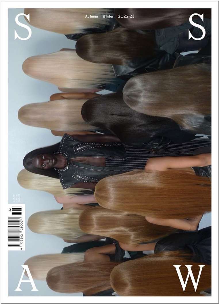Magazine cover featuring an African woman surrounded by blonde, light brown, and dark brown hair, wearing a studded leather jacket.
