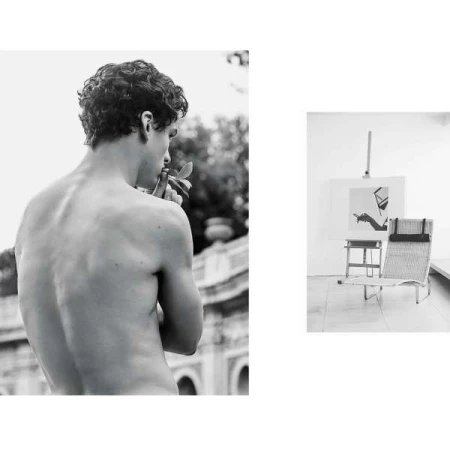 Black and white portrait of a shirtless young man holding leaves with an easel and chair visible in an inset frame.
