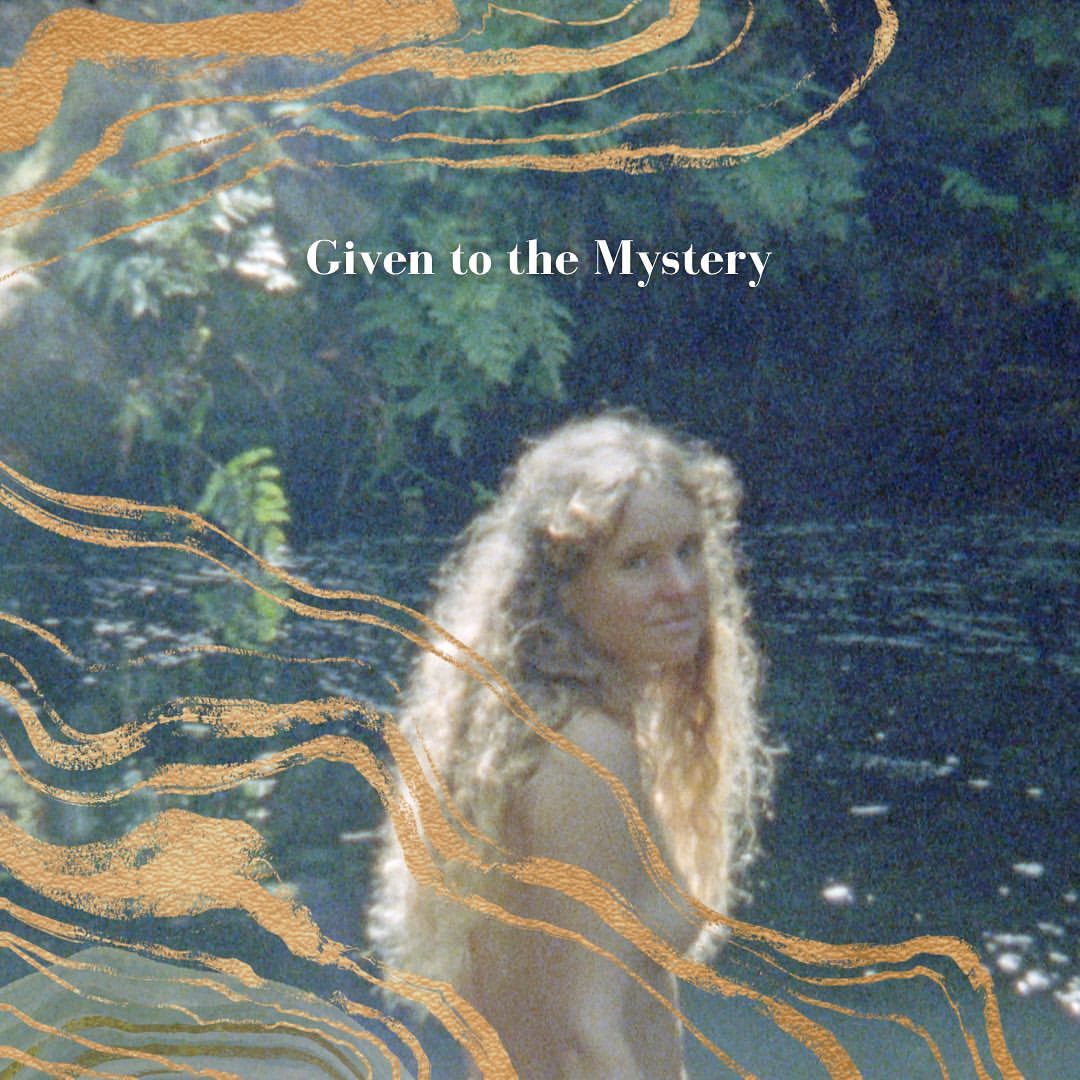 Album cover features a woman with long blonde hair standing in a stream surrounded by green foliage and gold brush stroke effects.