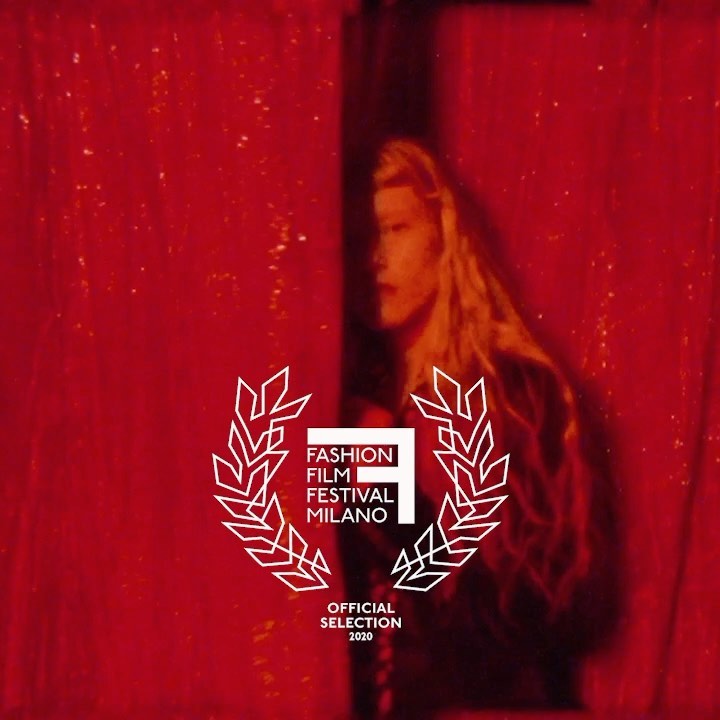 Fashion film festival Milano image features a woman with long blonde hair standing in front of a red curtain and a festival logo.
