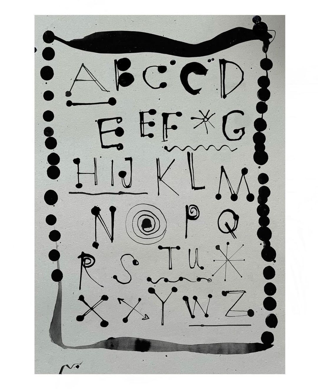 Alphabet illustration featuring black ink drawings of letters A to Z, decorative dots, lines, and swirls on white background.