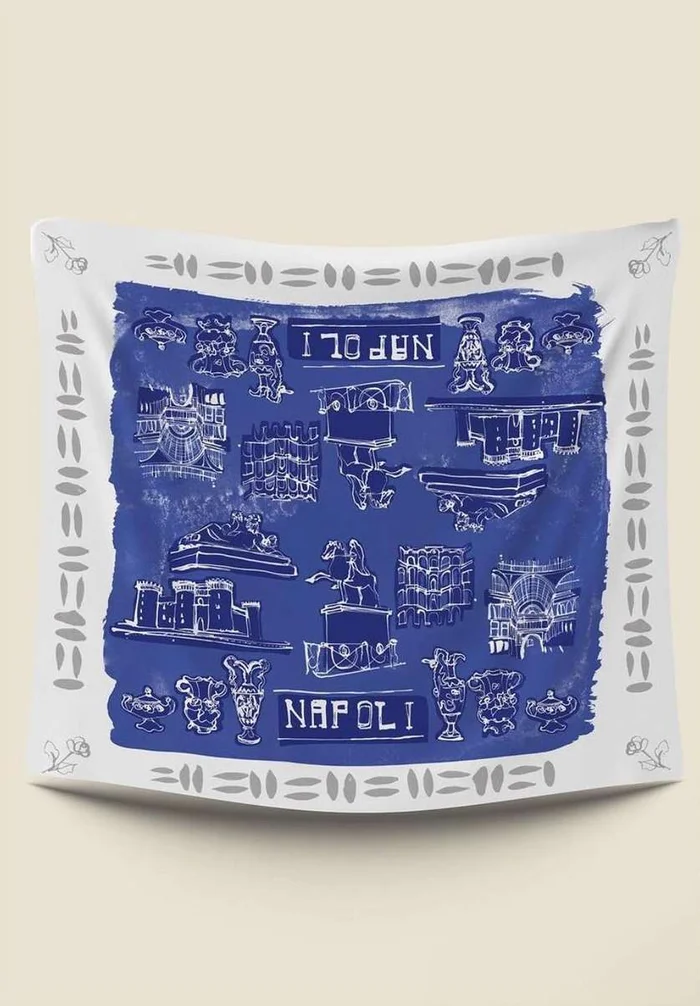 Blue and white illustrated textile design by Caroline Tomlinson featuring landmarks of Naples and the text Napoli.