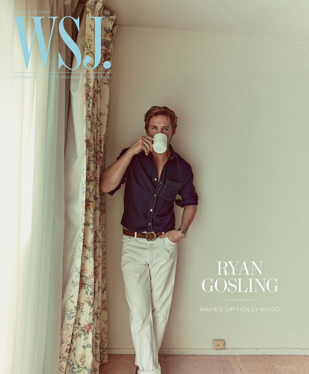 Magazine cover features Ryan Gosling drinking from a white mug, wearing a navy shirt and white pants, leaning against a wall.