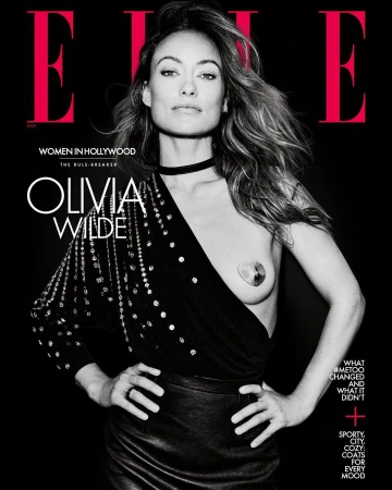 Olivia Wilde covers ELLE Women in Hollywood, wearing a black top and skirt against a black background with red letters.   