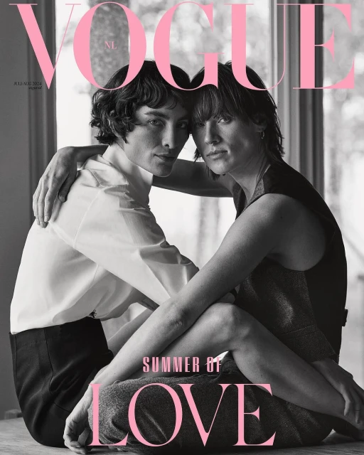 Vogue magazine cover featuring a close-up portrait of two women embracing, styled with modern hairstyles and minimalist fashion.