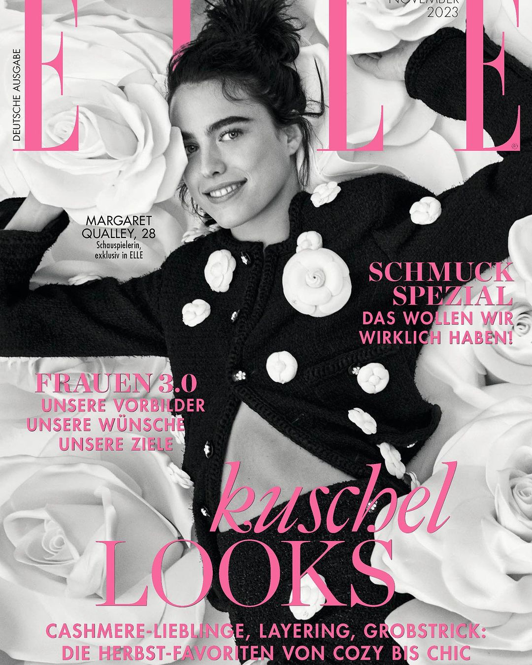 Elle magazine cover featuring Margaret Qualley, November 2023 issue, in a black and white floral jacket, and floral background.