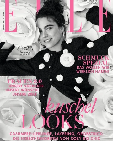 Elle magazine cover featuring Margaret Qualley, November 2023 issue, in a black and white floral jacket, and floral background. 