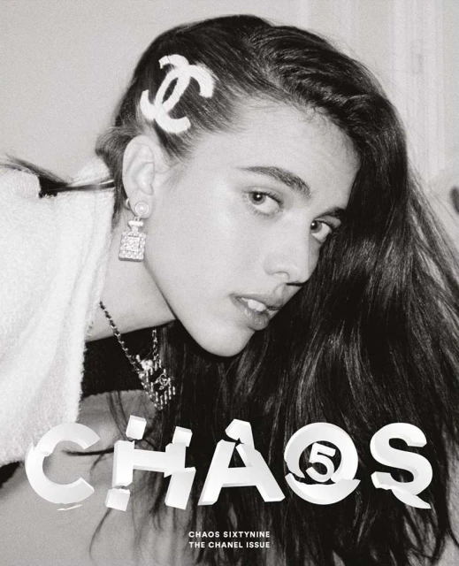 Black-and-white portrait of a woman with long hair wearing a Chanel hair clip and earrings, with 'CHAOS' text overlay.