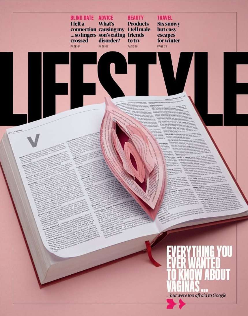Lifestyle magazine cover featuring an open book with a 3D paper sculpture in the shape of a vulva in the center and text about vaginas.