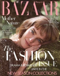 Magazine cover featuring Natalia Vodianova resting her head on mossy ground in a sparkling top