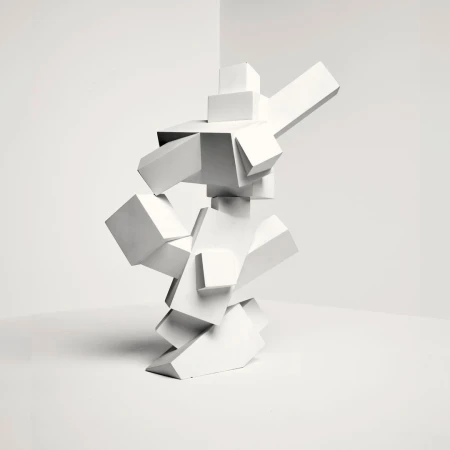 Abstract geometric sculpture of stacked white cubes in a bright, minimalist corner with bright, even lighting for a modern art display.