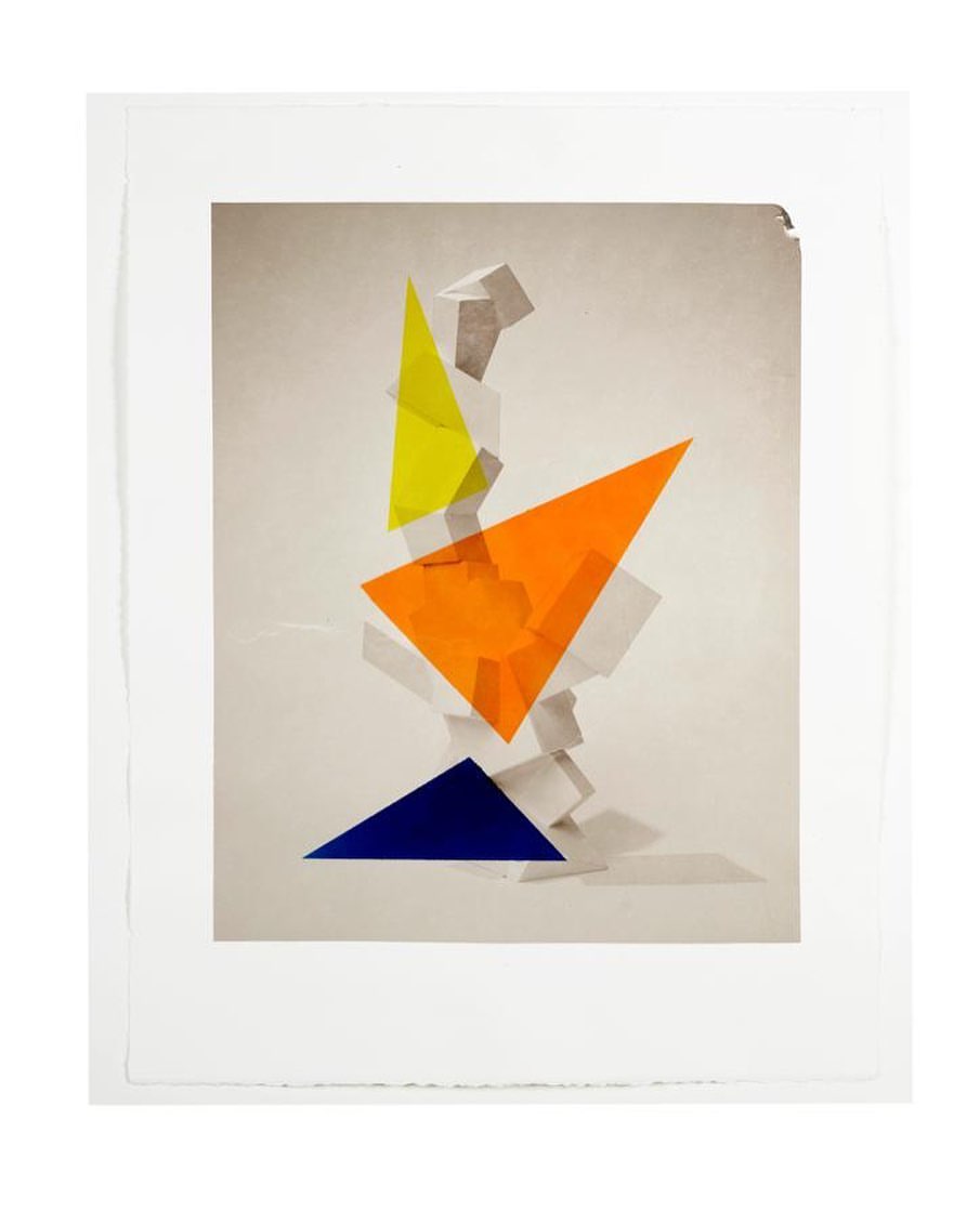 Abstract geometric composition featuring overlapping transparent triangles in yellow, orange, and blue, set against a neutral background.