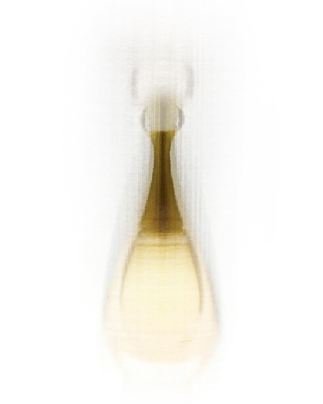 Close-up of a perfume bottle with a rounded bottom and thin neck, set against a clean white background in a beauty shot.