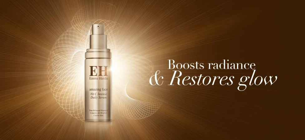 Emma Hardie skincare product, Vit C Intense Daily Serum, showcased against a radiant gold background with geometric patterns, promoting radiance and glow.