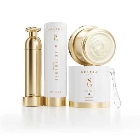 Opatra Skingenie skin care products arranged in a studio setting, featuring a golden serum, a white tube, a cream jar, and applicator.