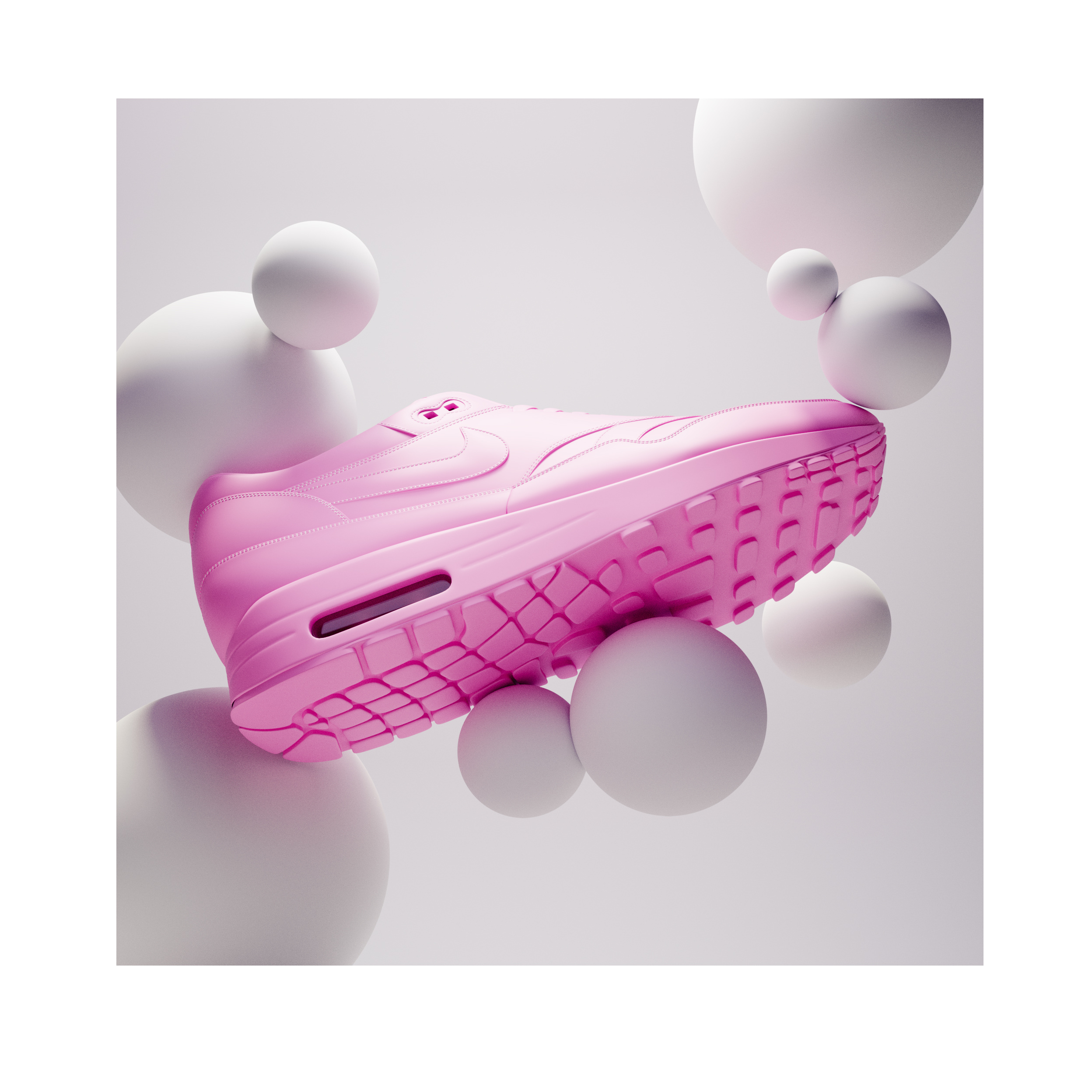 A pink Nike Air Max 1 sneaker levitates among white spheres against a light gray backdrop in a studio product shot.