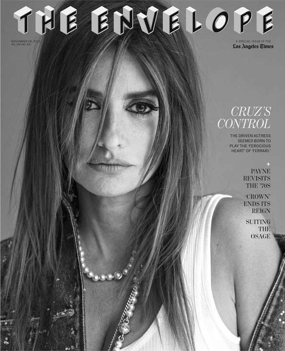 Black-and-white magazine cover featuring a close-up of actress Penelope Cruz, wearing a pearl necklace and denim jacket, with prominent text.
