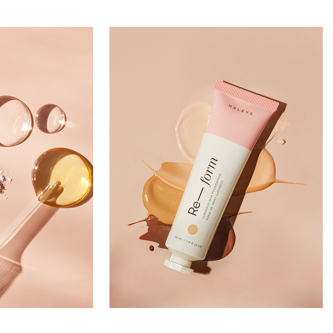 Product shot of Haley's Re-Form luminous skin foundation with color swatches and cosmetic oil drops on a beige background.