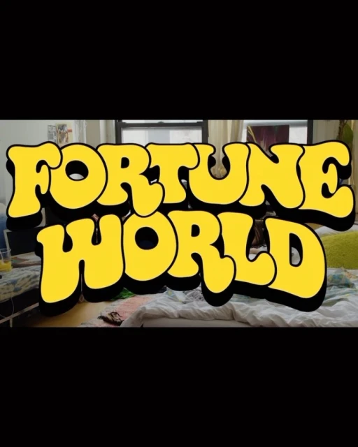 Cartoon-style yellow block letters spell out 'Fortune World' above a slightly messy bedroom interior with bed, window, and miscellaneous items.
