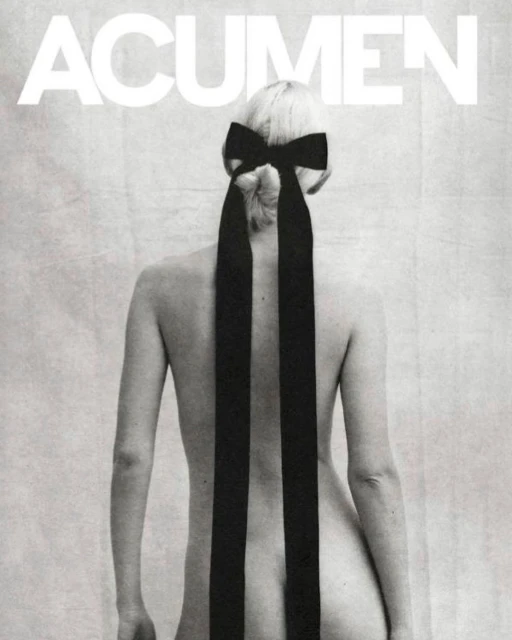 Back view of woman with blonde hair styled in a bow. Black and white, minimal composition with fashion and beauty elements.