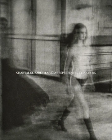 Blurred sepia-toned fashion shot of a woman walking, wearing knee-high boots. Studio with faded walls provides soft, filtered lighting.