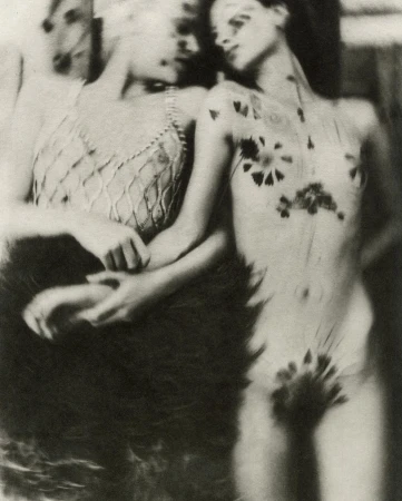 Two women posing together with floral and botanical decorations on skin in a photographic portrait by Chantal Elisabeth Ariens.