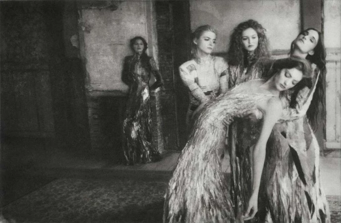 Black and white editorial fashion photography by Chantal Elisabeth Ariens showing five female models in an interior setting.