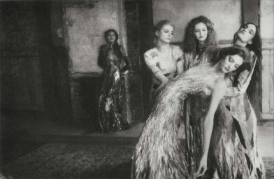 Black and white editorial fashion photography by Chantal Elisabeth Ariens showing five female models in an interior setting.