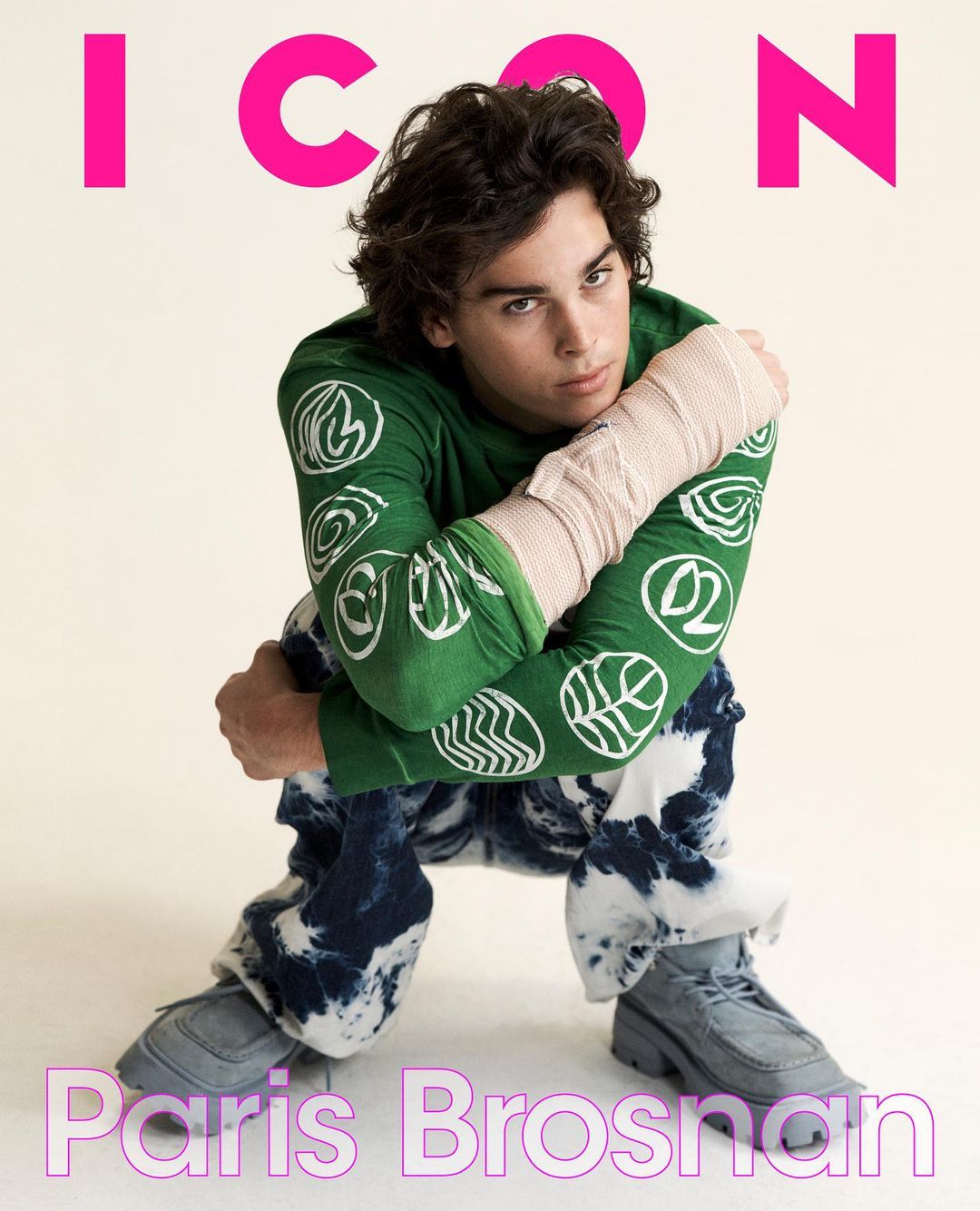 Magazine cover featuring Paris Brosnan in a green patterned shirt and tie-dye jeans, seated against a neutral background.