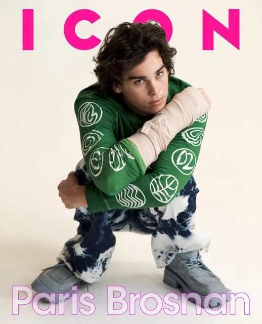 Magazine cover featuring Paris Brosnan in a green patterned shirt and tie-dye jeans, seated against a neutral background.