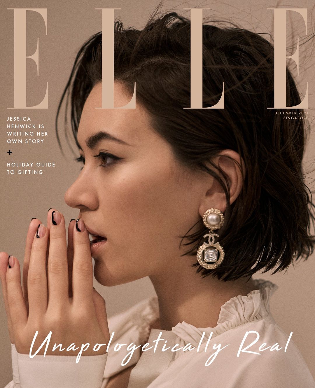 Elle Magazine cover featuring model Jessica Henwick, December 201, Singapore edition. Close-up profile with statement earrings.