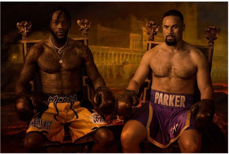 Two shirtless male boxers, Deontay Wilder and Joseph Parker, sit on thrones with boxing gloves, posing in an indoor environment with a backdrop of coliseum.